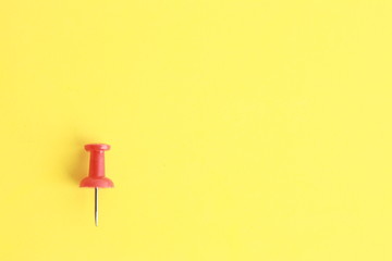 plastic thumbtacks in colorful background