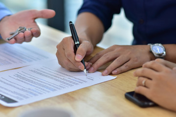 Close up People are signing house purchase contracts
