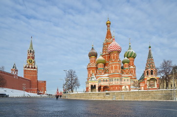 Cathedral of the Intercession of the blessed virgin Mary, on the Moat (St. Basil's Cathedral) and the Spasskaya tower of the Moscow Kremlin on a winter day. Moscow, Russia