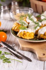 Fresh, hot, corn zucchini muffins with sour cream