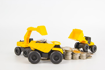 Construction vehicle toys working with coin group for business and financial, isolated