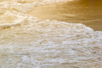 Fototapeta na wymiar Sea and sand as golden light