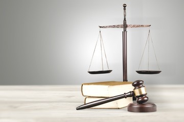 Justice Scales and book and wooden gavel on table. Justice concept
