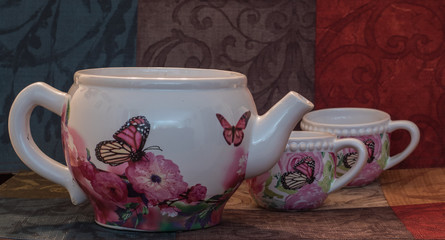 Tea pot family with colorful background