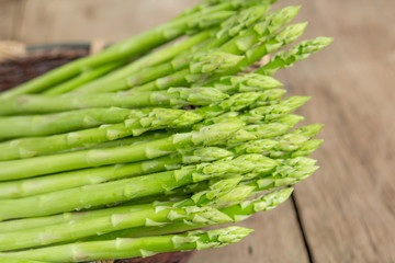 Asparagus with a wooden background