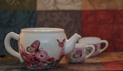 Tea pot family with colorful background