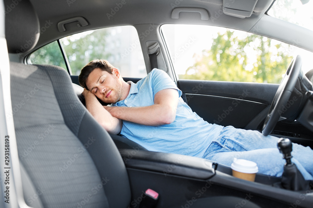 Wall mural transport, rest and driving concept - tired man or driver sleeping in car