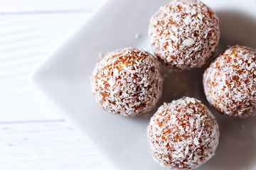 mouth-watering energy balls on a white square plate
