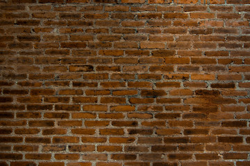 Red brown brick wall dark texture background.