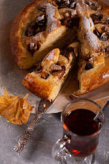 Fresh sweet fruit cake sprinkled with powdered sugar and cinnamon