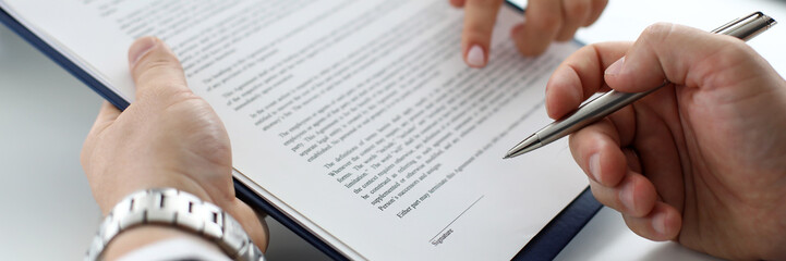 Real estate clerk offering visitor document to sign closeup