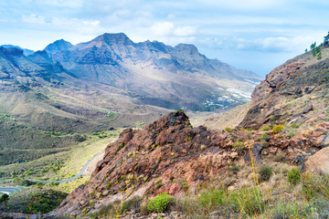 Fototapeta na wymiar Nature landscape of Canary Island with mountain range, green hills and curvy road