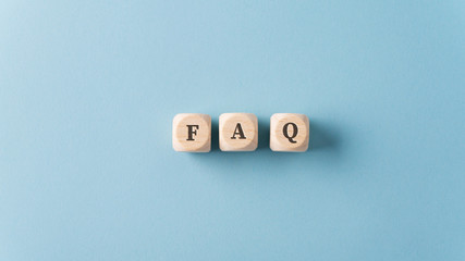FAQ sign over light blue background - obrazy, fototapety, plakaty