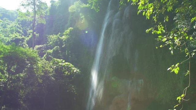 Amazing Unseen Waterfall view in deep forest Lush green leafes and sunshine in the morning. Saraburi Asia Thailand