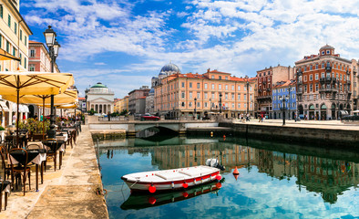 Landmarks and beautiful places (cities) of northern Italy - elegant Trieste with charming streets and canals - obrazy, fototapety, plakaty