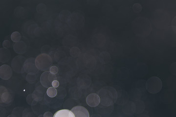 abstract sparkle bokeh light effect  with dark vintage background, abstract bokeh background