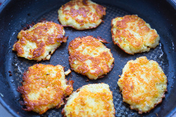 Hash browns fried on a pan