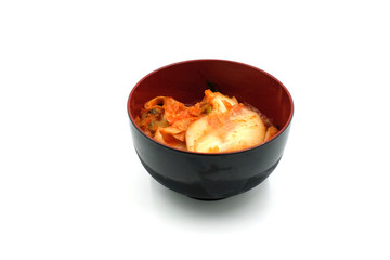 Kimchi cabbage in a bowl on white background