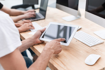 close up. the employee uses a digital tablet in the workplac