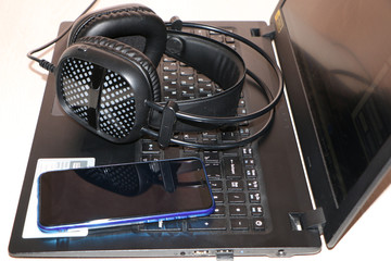 close up - computer and smart phone against wooden background