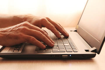 close up - computer and smart phone against wooden background