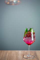 Pomegranate Cocktail Decorated with Mint Leaves and Ice, Cold Drink, Vertical Wallpaper, Free Space for Text