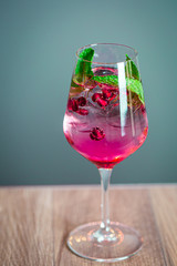 Pomegranate Cocktail Decorated with Mint Leaves and Ice, Cold Drink, Vertical Wallpaper, Free Space for Text