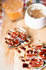 Breakfast Concepts, Toasts with Cream Cheese, Figs, Pine Nuts and Raspberry Balsamic Sauce, Cup of Cappuccino and Carrot-Apple Juice
