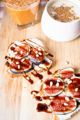 Breakfast Concepts, Toasts with Cream Cheese, Figs, Pine Nuts and Raspberry Balsamic Sauce, Cup of Cappuccino and Carrot-Apple Juice