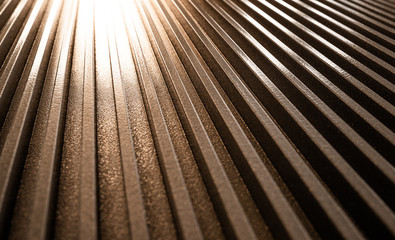 Obraz premium Close-up of a golden corrugated metal surface