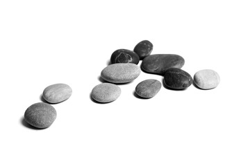 Sea pebbles. Heap of smooth gray and black stones isolated on white background