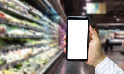 Shopper Mobile smart phone in hand, and see more detail and compare the prices in supermarkets.