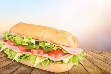Ham and cheese salad submarine sandwich from freshly cut baguette