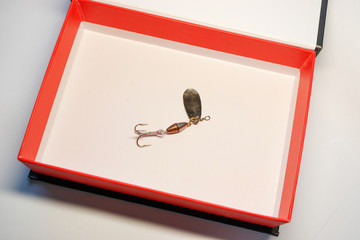 fishing lure attachment for catching a predator with a triple hook works as a spinner