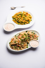 Broken wheat or Daliya Upma, served in a bowl. selective focus