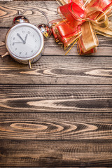 Christmas wooden background, clock gifts