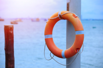 Safety Torus is hanged on the pole,Sea and ocean security equipment,copy space.