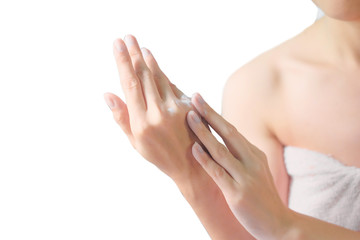Woman applying moisturizing cream/lotion on hands, beauty concept.
