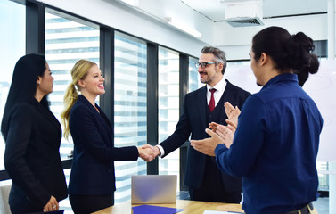 Business team working group meeting in office and Successful project