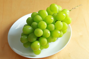 Green grapes on whitebackground