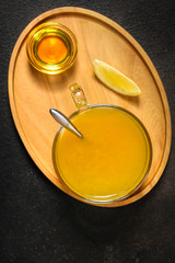 tea, honey, lemon and sea buckthorn (aromatic mustard drink in a cafe restaurant) menu concept. food background. copy space. Top view