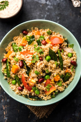 Broken wheat or Daliya Upma, served in a bowl. selective focus