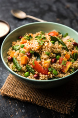 Broken wheat or Daliya Upma, served in a bowl. selective focus