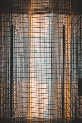 Fototapeta premium Glass roof in which you can see the sunset and blue sky