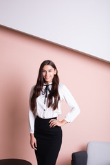 Studio portrait of smiling positive business woman.