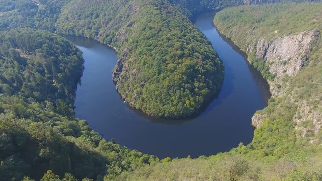 Aerial view of Vltava river horseshoe meander with green forest near Maj view point next to Prague in central Bohemia, Czech republic
