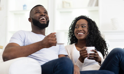 Black Couple Enjoying Time Together, Drinking Coffee at Home