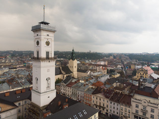 Fototapeta na wymiar aerial view of european central square with bell tower overcast rainy weather