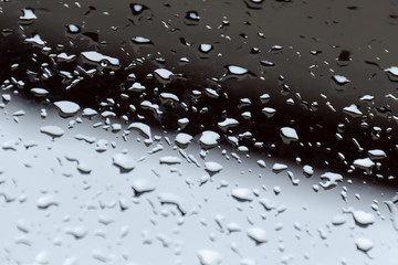 Water drops on dark  glass.