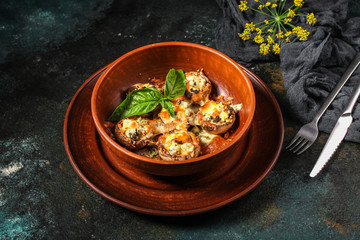 mushroom stuffed cheese (delicious baked vegetable dish, no meat) menu concept. food background. copy space. Top view